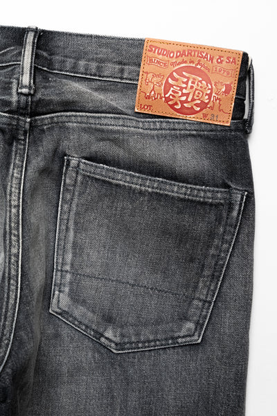 Studio D'Artisan Original Japanese Selvedge denim - 13oz in a Relaxed Taper Fit. Color: Faded Black. Distressed and Rope dyed 