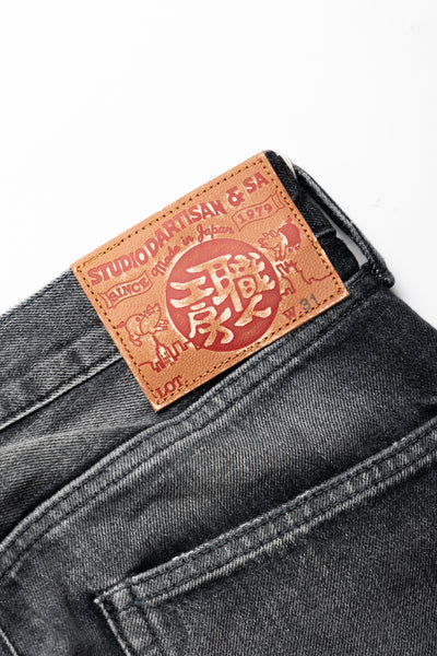 Studio D'Artisan Original Japanese Selvedge denim - 13oz in a Relaxed Taper Fit. Color: Faded Black. Distressed and Rope dyed 