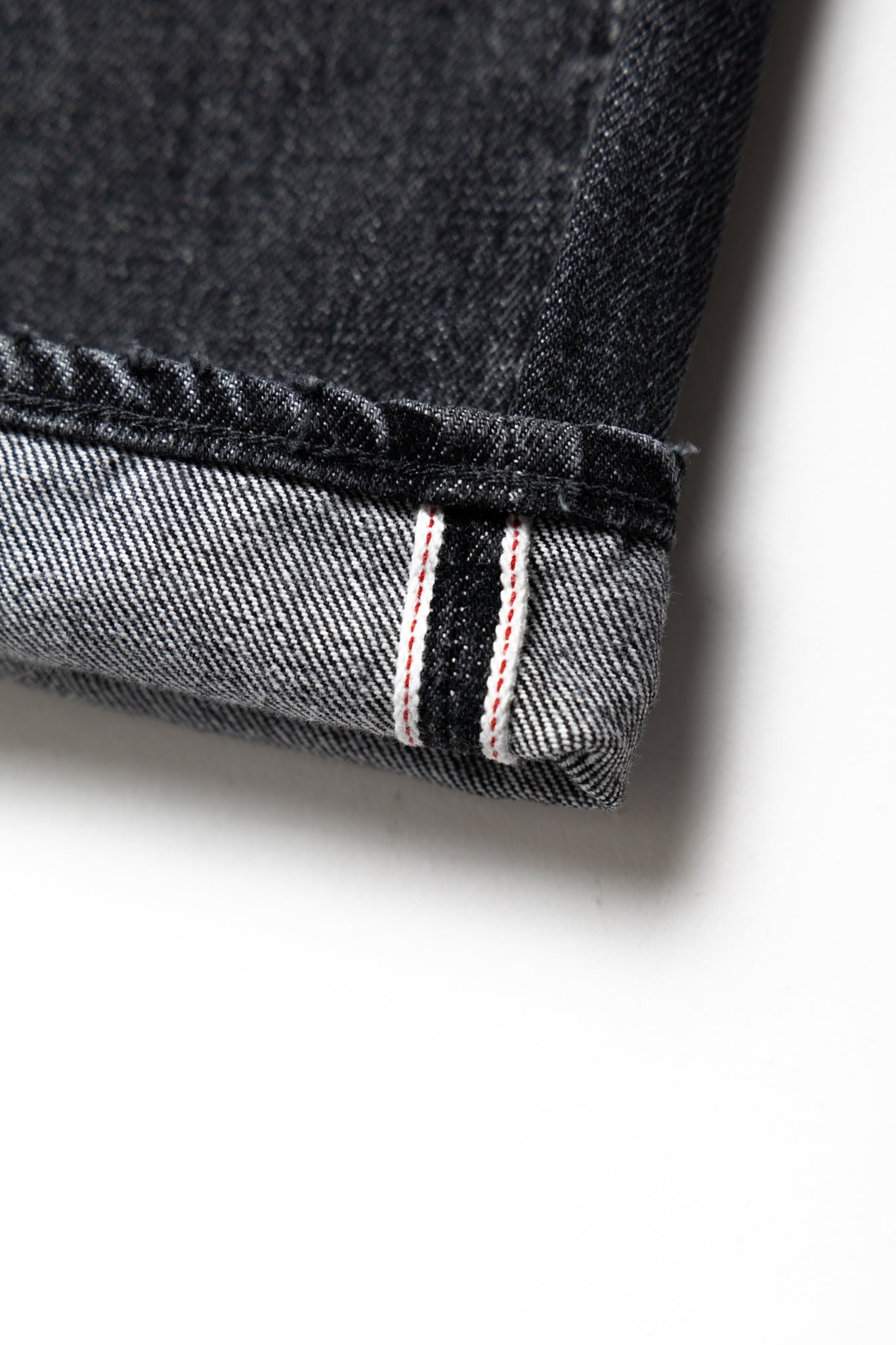 Studio D'Artisan Original Japanese Selvedge denim - 13oz in a Relaxed Taper Fit. Color: Faded Black. Distressed and Rope dyed 