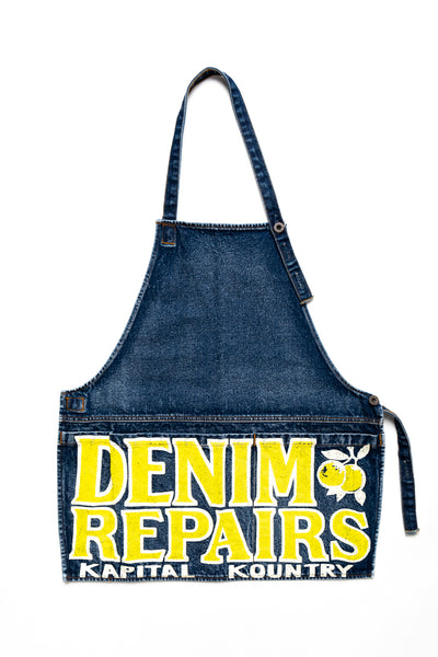 Kapital 2023 Spring Summer advertising apron with a vintage-like logo 3 pockets with different sizes. Featured on the apron is yellow Novelty typography. 13oz distressed denim. Color: Yellow 100% Cotton Made in Japan. 
