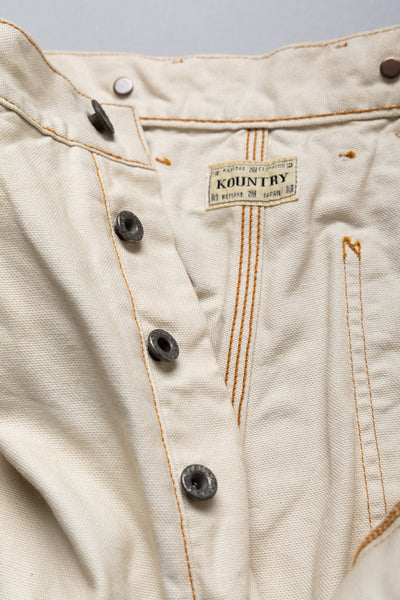 Made by Kapital are lumber pants inspired by overalls. Intricate stitching and intentional distressed details throughout front on pants. Loose fit. 100% Cotton. Made in Japan 