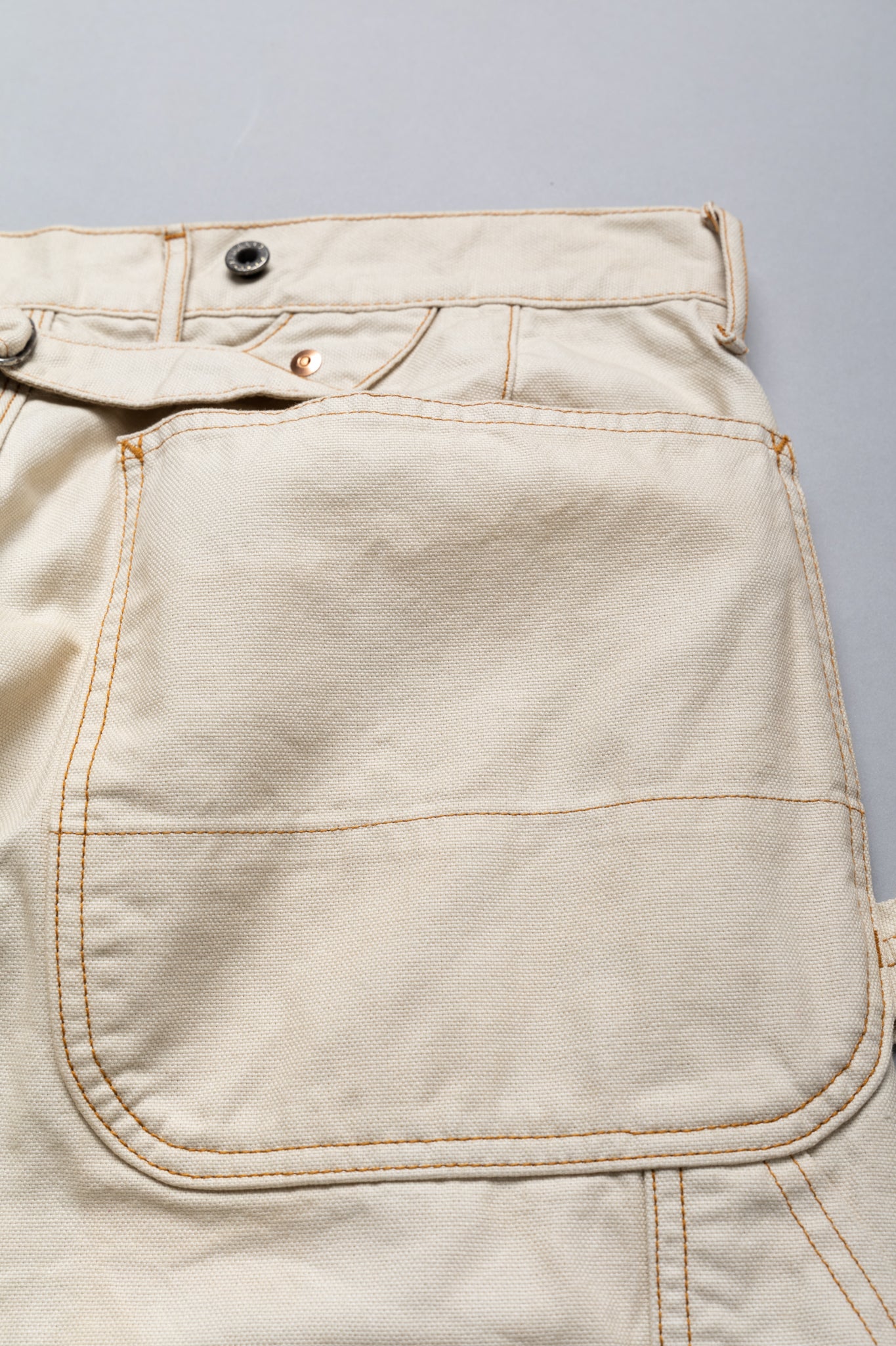 Made by Kapital are lumber pants inspired by overalls. Intricate stitching and intentional distressed details throughout front on pants. Loose fit. 100% Cotton. Made in Japan 