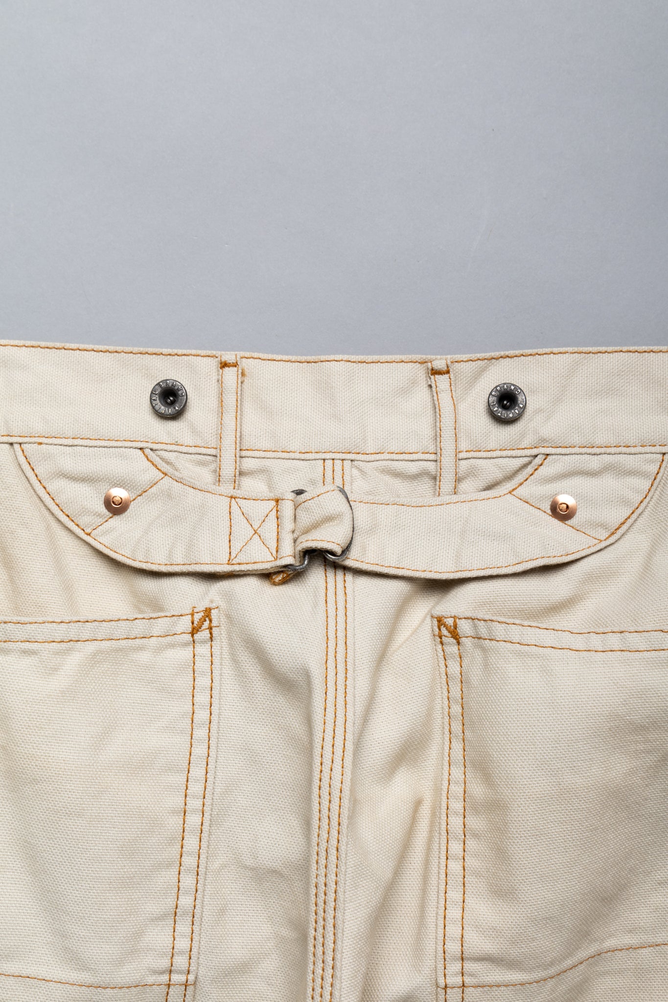 Made by Kapital are lumber pants inspired by overalls. Intricate stitching and intentional distressed details throughout front on pants. Loose fit. 100% Cotton. Made in Japan 