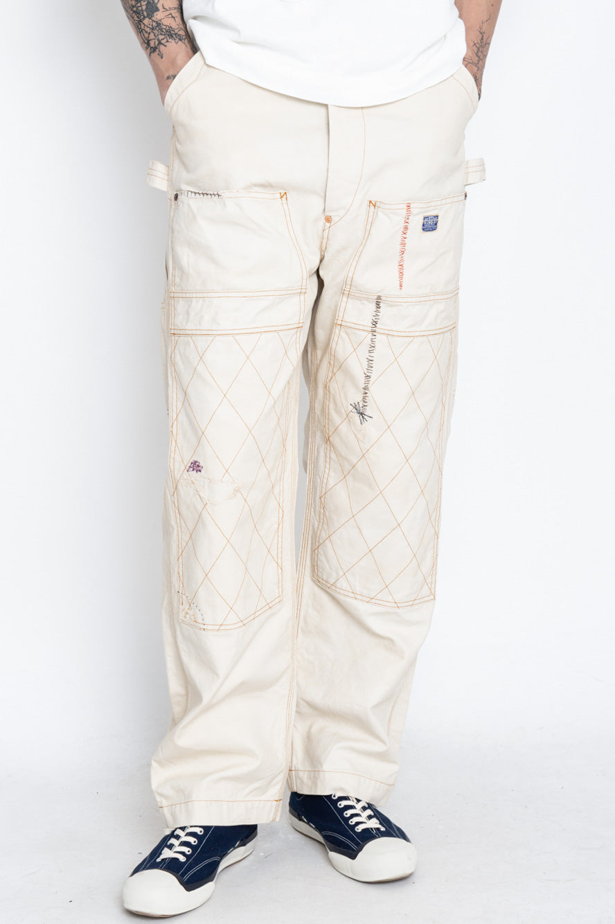 Made by Kapital are lumber pants inspired by overalls. Intricate stitching and intentional distressed details throughout front on pants. Loose fit. 100% Cotton. Made in Japan 