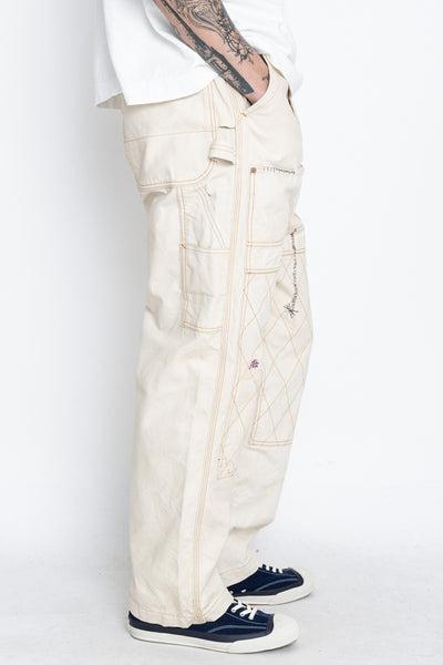 Made by Kapital are lumber pants inspired by overalls. Intricate stitching and intentional distressed details throughout front on pants. Loose fit. 100% Cotton. Made in Japan 