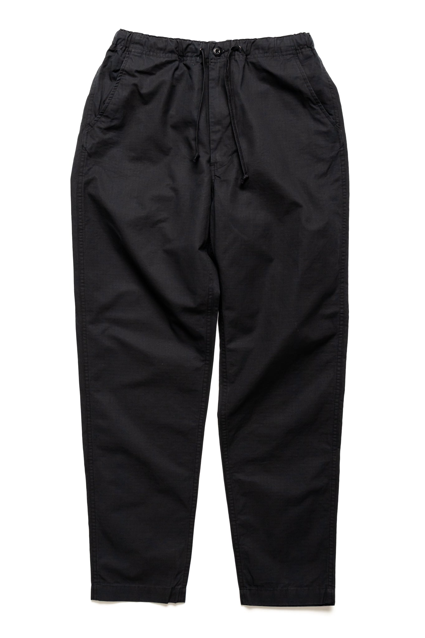 Orslow's easy to wear trousers with an elastic waist and cord drawstring made in Japan. 100% cotton ripstop fabric. Straight leg with a slight taper that features two front pockets and one back. 