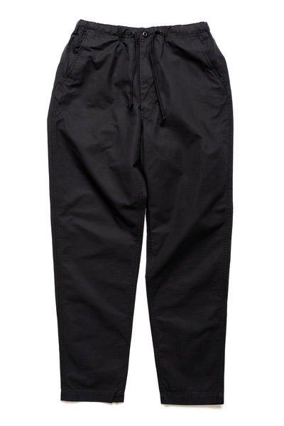 Orslow's easy to wear trousers with an elastic waist and cord drawstring made in Japan. 100% cotton ripstop fabric. Straight leg with a slight taper that features two front pockets and one back. 