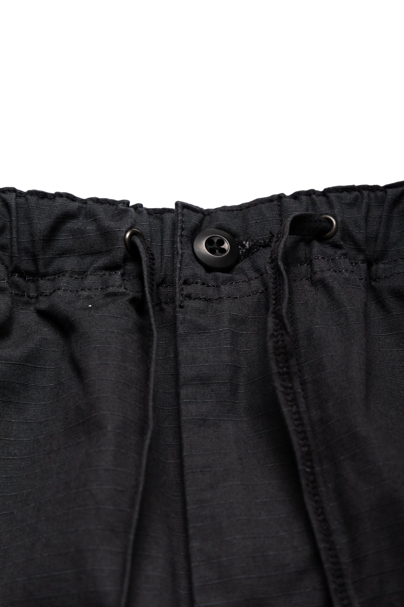 Orslow's easy to wear trousers with an elastic waist and cord drawstring made in Japan. 100% cotton ripstop fabric. Straight leg with a slight taper that features two front pockets and one back. 