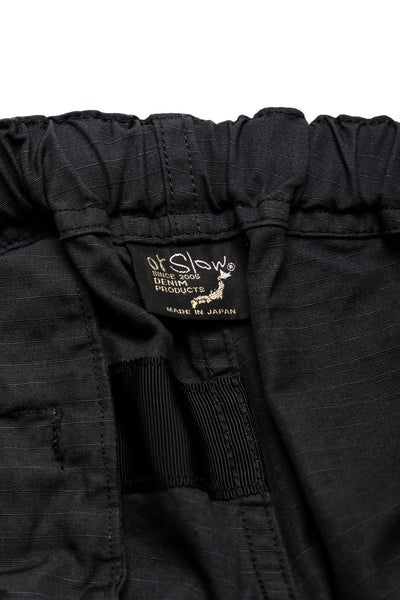 Orslow's easy to wear trousers with an elastic waist and cord drawstring made in Japan. 100% cotton ripstop fabric. Straight leg with a slight taper that features two front pockets and one back. 