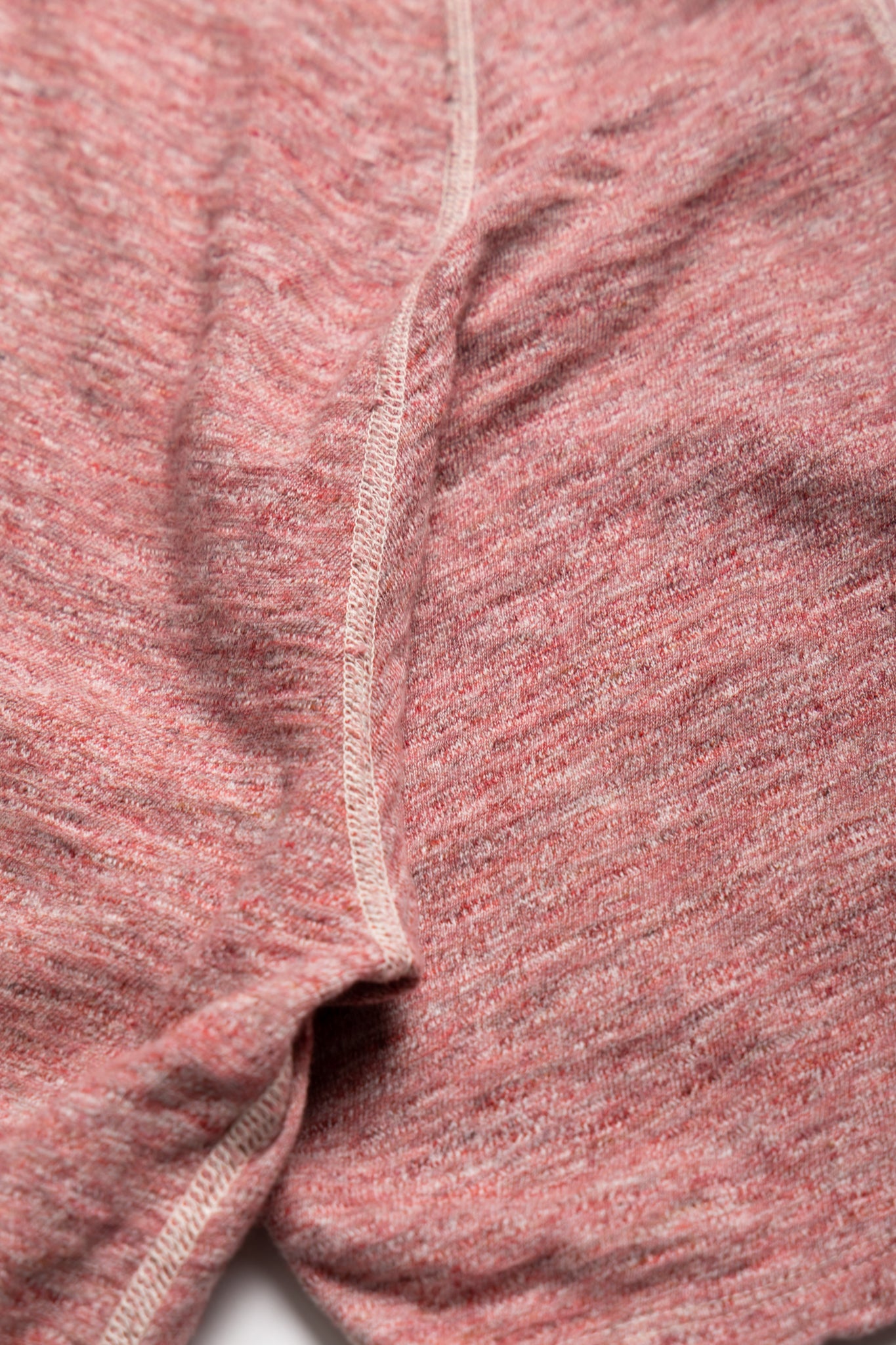 From Loop & Weft is an uneven heather slub knit. Vintage Inspired Double binder neck Set-in on the front and raglan sleeve on the back. Cotton thread stitching. Color: Red Cherry. One wash. Unisex regular fit. 100% cotton. Made in Japan