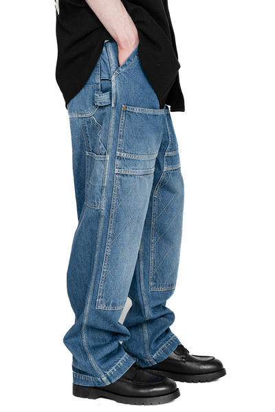 Kapital loose fitting pants inspired by overalls. A number of pockets are in various places, replicating cargos and overalls. Intentional distressing. Color:Faded indigo. 100% Cotton Made in Japan 