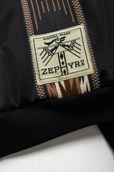Kapital Black A truck jacket with an eye -catching Ortega pattern front line. The sleeves are stitched with corduroy fabric in the middle ridge. 100% polyester Sleeve parts: 98% cotton, 2% polyurethane Made in Japan 