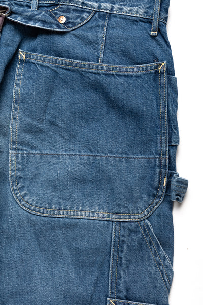 Kapital loose fitting pants inspired by overalls. A number of pockets are in various places, replicating cargos and overalls. Intentional distressing. Color:Faded indigo. 100% Cotton Made in Japan 