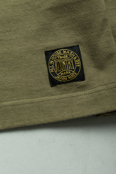 Kapital football long T-shirt made of thick and firm jersey. Utility pockets on the sleeve. Color: Khaki Made in Japan 100% cotton