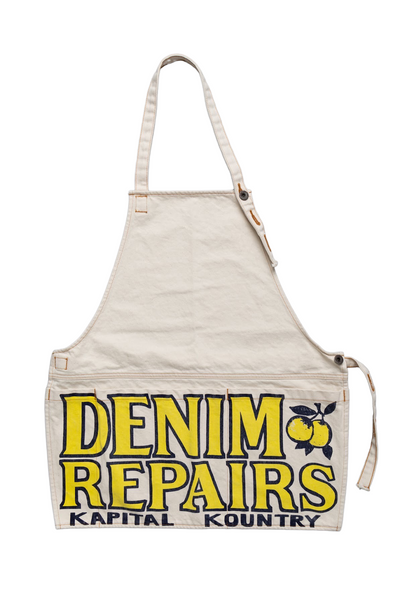 Kapital 2023 Spring Summer advertising apron with a vintage-like logo 3 pockets with different sizes. Featured on the apron is yellow Novelty typography. 13oz distressed denim. Color: Ecru 100% Cotton Made in Japan. 