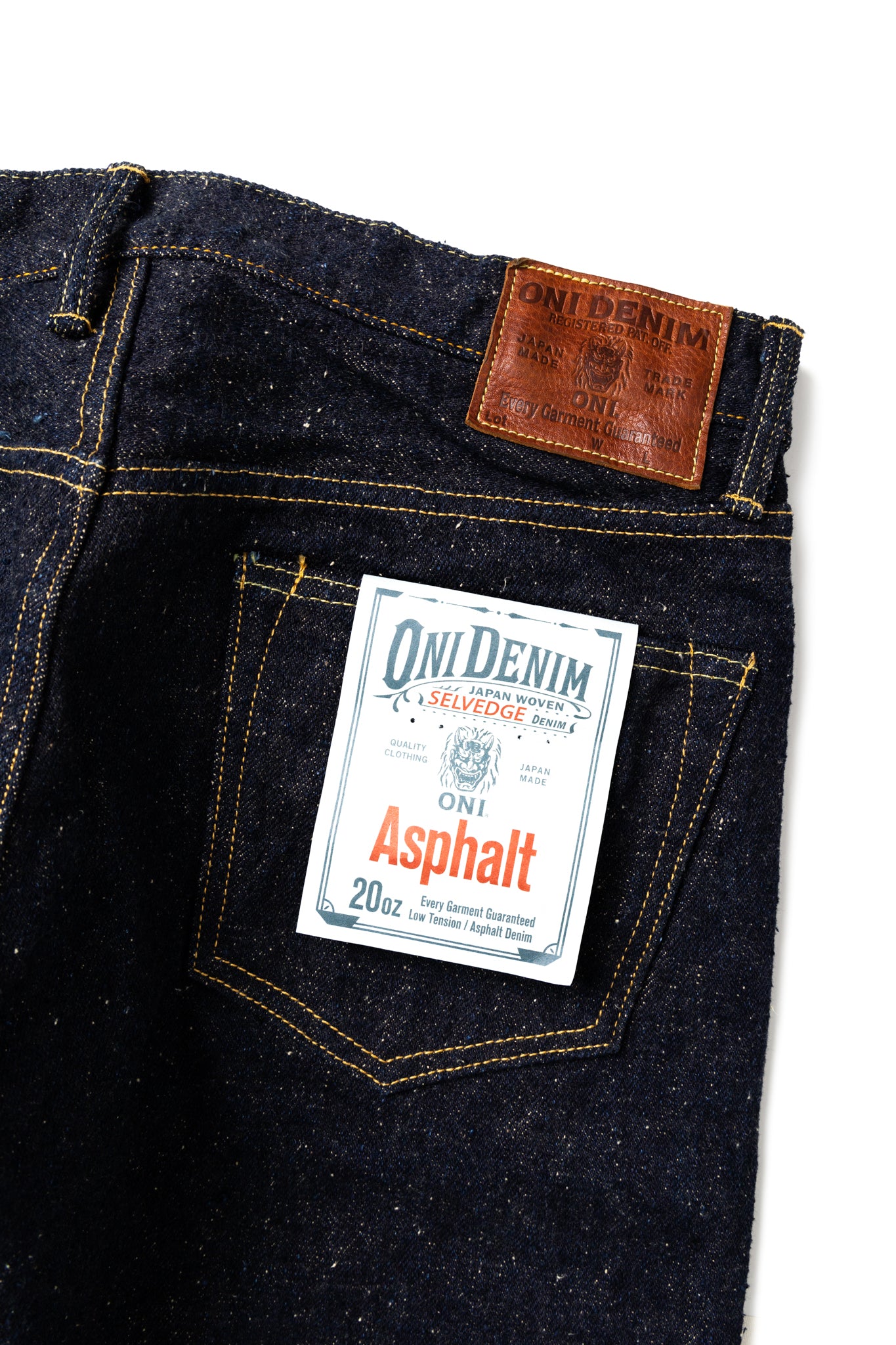 Oni Denim, legends of denim, new heavyweight selvedge- the Asphalt. Extreme slubbiness and neppy construction, weighing in at 20oz in a Relax Tapered fit. A dark indigo denim that is rugged and woven with low tension, using specially twisted thick yarns. Oni Original Japanese Selvedge denim featuring a cow leather patch. One Wash. Special edition for Blue in Green featuring plain rear pockets. Made in Japan. Model is 6'3 wearing a size 34. Unisex. 100% Cotton. 