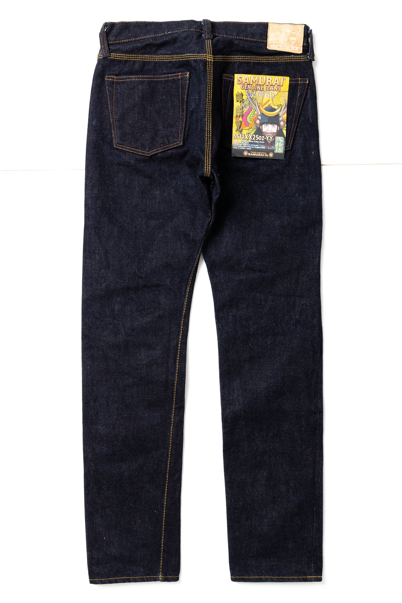 Samurai Jeans has released a limited edition"Kirinji" denim that rivals the rest. Coming in at 25oz, it is a true dark denim staple. Slim tapered in design, the jeans feature hidden rivets and an Iron Matsunoki button (tribute the laurel button and change the design to a lucky pine tree), and a Deerskin patch. 100% Cotton. Indigo (rope dyed). Made in Japan. Model is 6'3 and wearing a size 34. Unisex. 