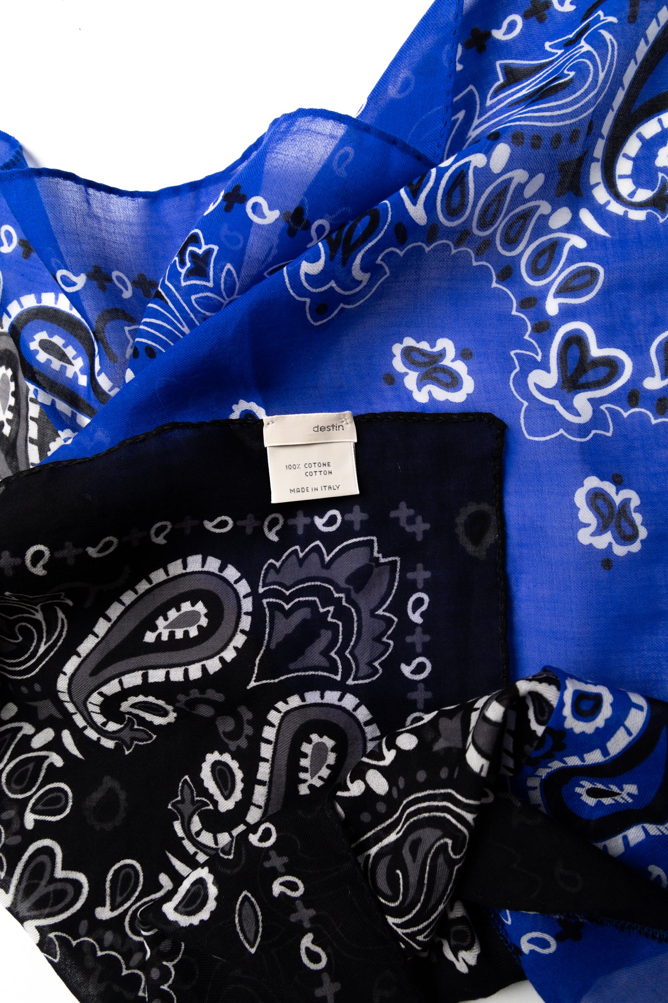 Destin Italian made Bandana. Color: Black x Blue 2 tone Extra fine cotton Light and soft touch 100% cotton Made in Italy Size: 23.5" x 23.5". Use as multipurpose scarf or bandana wrap. Unisex.